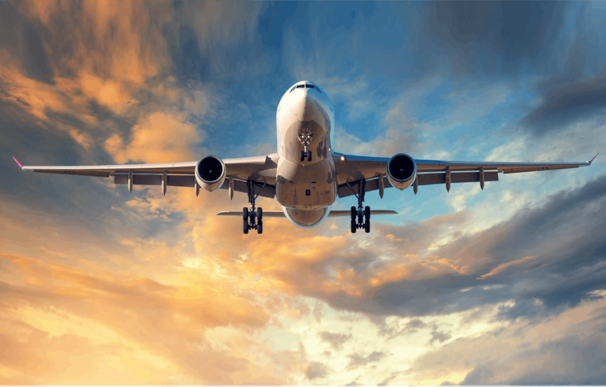 Airplane flying through a sunset sky - Skytrax Airline Awards 2018 - World's Best Airlines 2018